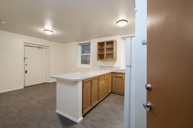 Kitchen island and living area, seen from the entry